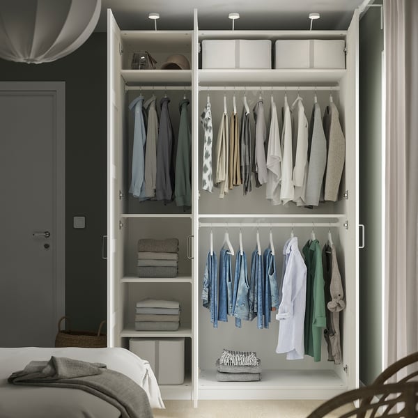Open wardrobe with hangers, shelves, and adjustable feet.