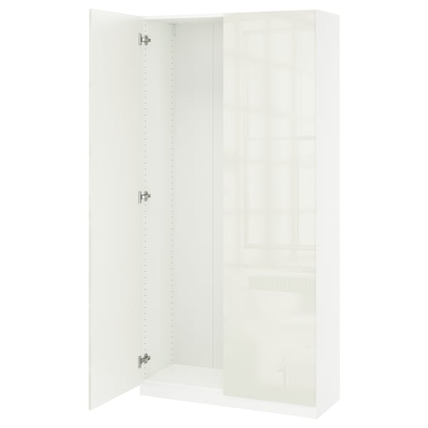 A white PAX wardrobe with one open door, featuring soft-close hinges.
