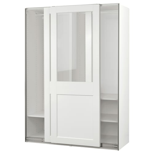 White PAX wardrobe with glass doors, modern minimalist design, wall-mounted storage, sliding doors, and metal racks.