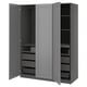 A grey PAX wardrobe with open doors, displaying drawers and shelves inside.