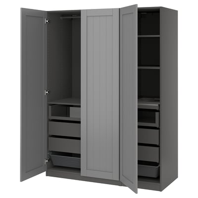A grey PAX wardrobe with open doors, displaying drawers and shelves inside.