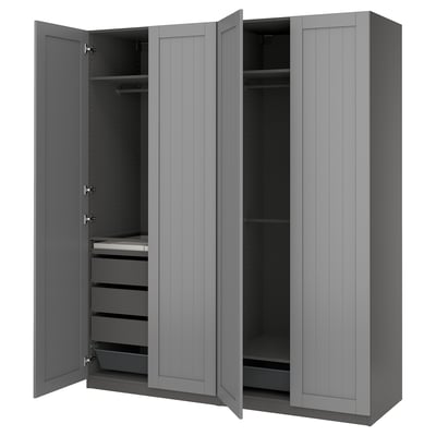 An open gray ikea PAX wardrobe with shelves and drawers.