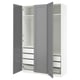 An open grey PAX wardrobe with shelves and drawers.