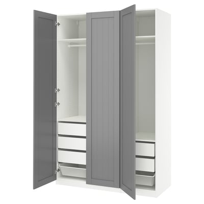 An open grey PAX wardrobe with shelves and drawers.
