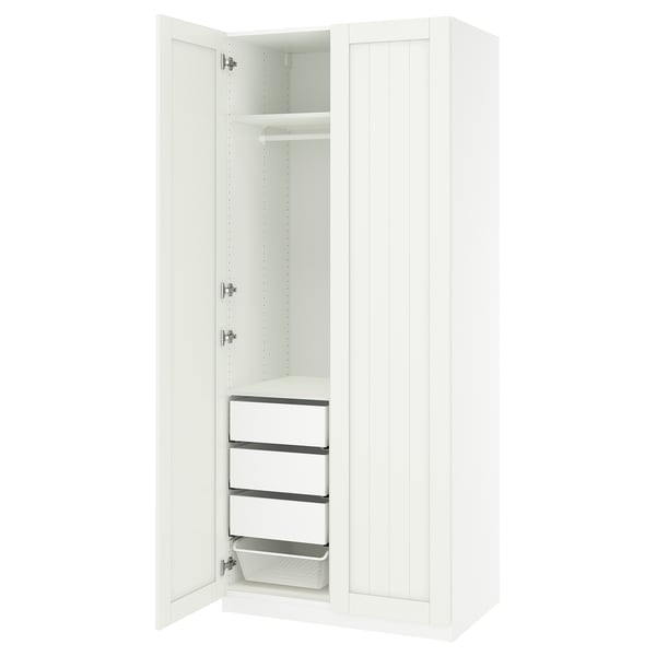 A white PAX wardrobe with open doors, revealing shelves and drawers. Its a storage unit with a clean design.