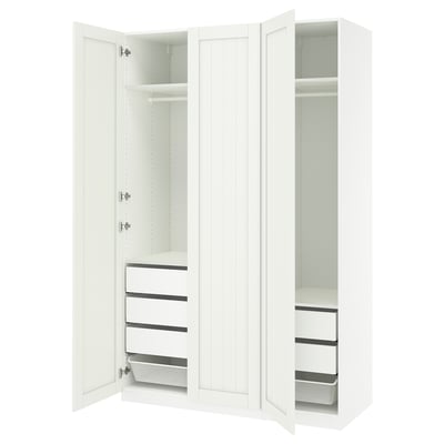 Displays a white PAX wardrobe with open doors, showing inner shelves, drawers, and a mesh basket.