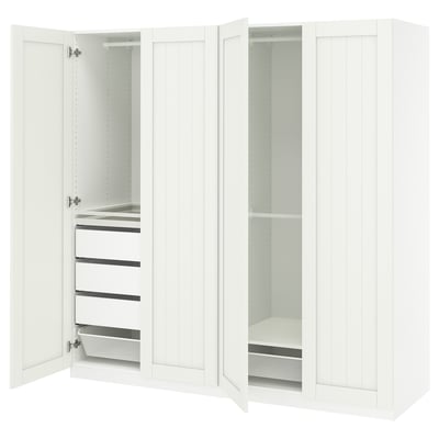 White PAX wardrobe: fully open, showing drawers, shelves, mesh basket, steel rail, and soft-close hinges.