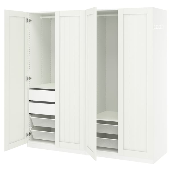 An open white PAX wardrobe with multiple storage compartments including shelves and drawers.