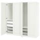 An open white PAX wardrobe with multiple storage compartments including shelves and drawers.