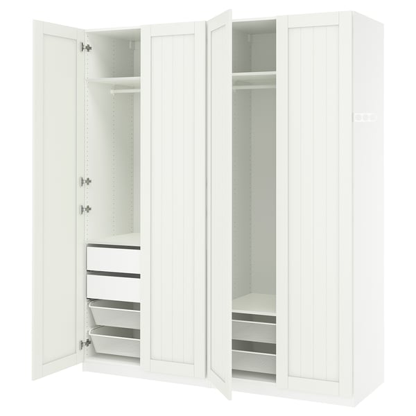 A white PAX wardrobe with open doors, revealing shelves, drawers, and mesh baskets inside.