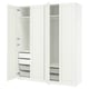 A white PAX wardrobe with open doors, revealing shelves, drawers, and mesh baskets inside.