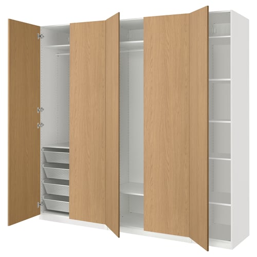 PAX wardrobe with light wood doors, white interior, and adjustable shelves.
