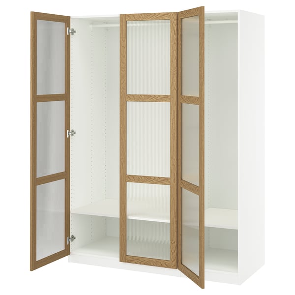 Open white PAX wardrobe with wood trim and glass doors.