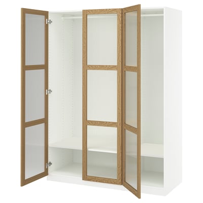Open white PAX wardrobe with wood trim and glass doors.