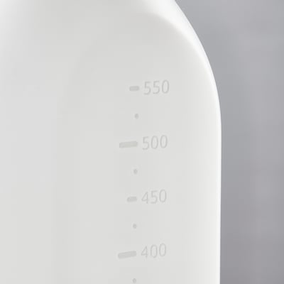 White spray bottle displaying measurement levels from 400 to 550 ml on curved side, set against a gradient grey background.