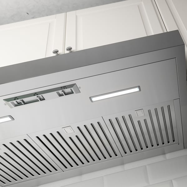 Modern stainless steel range hood, sleek design, integrated controls and led light.