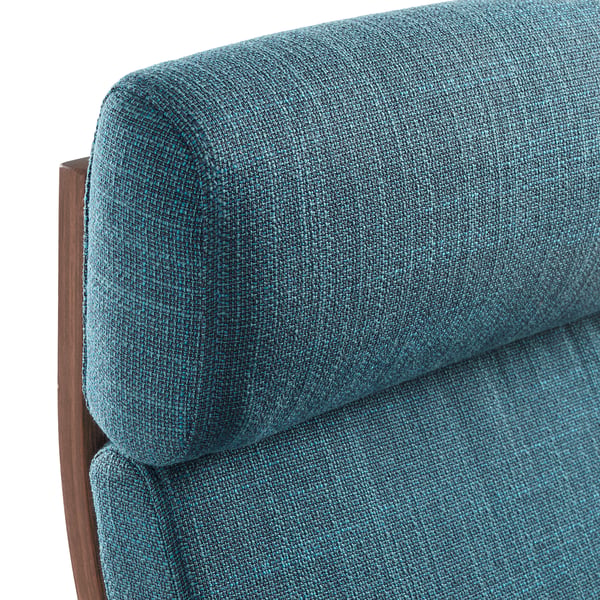 Close-up of a teal fabric chairs padded armrest, showcasing its quality and comfort.