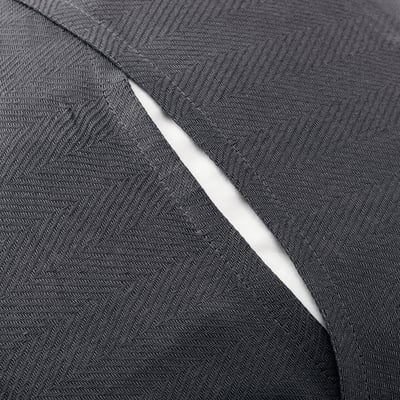 A folded dark grey fabric with herringbone pattern, likely a sustainable cotton cushion cover.