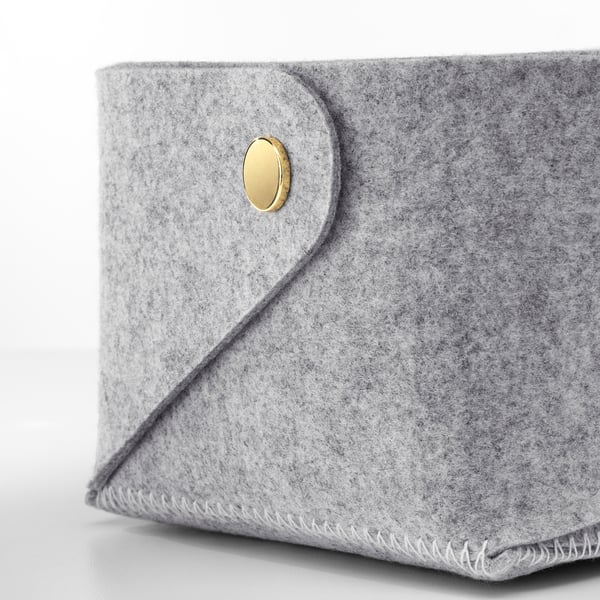 Grey pouch, gold button.