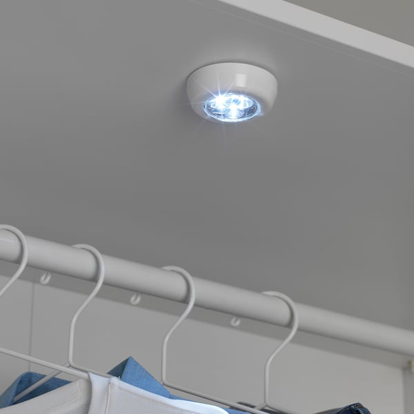 Small RAMSTA led light, white, plastic, round, ceiling-mounted, bright above clothes rack.
