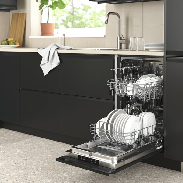Black RANSBERG dishwasher integrated into kitchen, displaying clean dishes, sleek dark cabinetry.