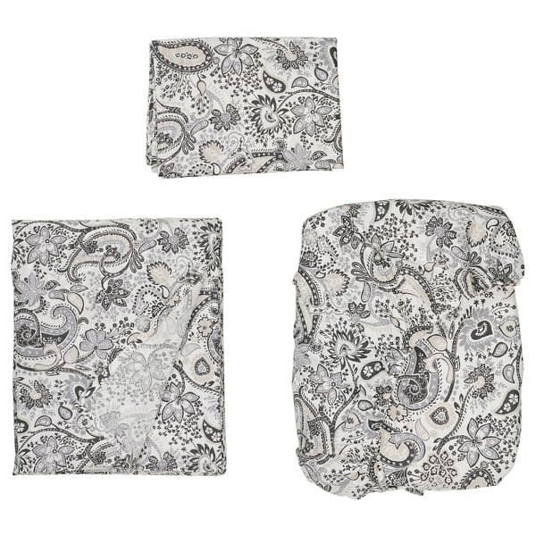 RODGERSIA bedding in black & white paisley. It a comforter and sheets, with intricate floral patterns.