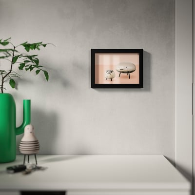 Framed picture on grey wall above white table, adjustable & ph-neutral mount.