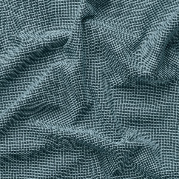 Soft, green sofa-bed fabric with intricate texture, emphasising its comfort and quality.
