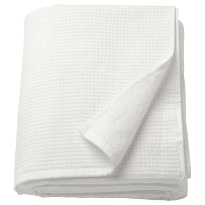 A folded white SALVIKEN bath sheet, featuring a waffle texture on one side and soft terry on the other, made from 100% cotton.