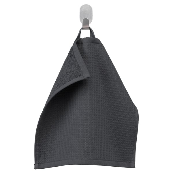 Dark grey SALVIKEN towel with waffle and terry textures hangs hooked, soft cotton.