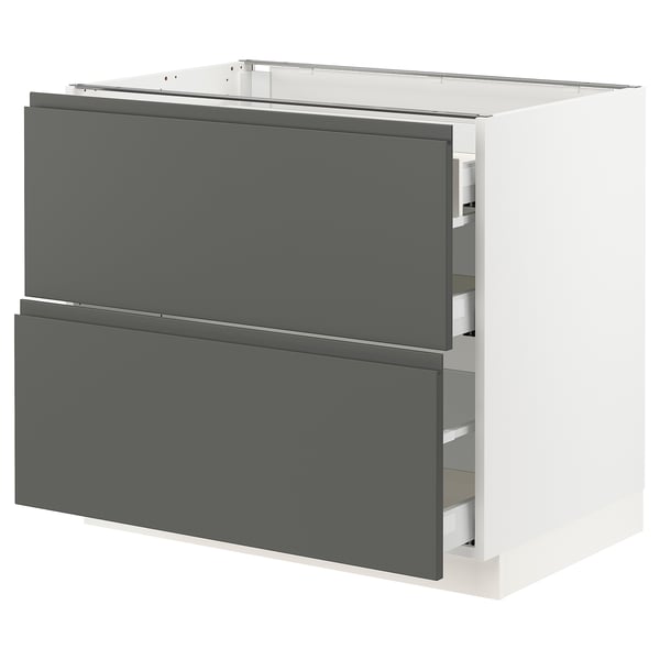 White ikea SEKTION kitchen cabinet with dark grey drawers, sleek modern design and integrated handles.