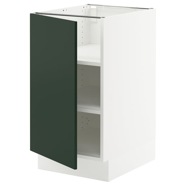 Modern white kitchen cabinet with dark green door and 2 shelves.