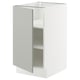An open white ikea SEKTION kitchen cabinet, modern and minimalist in design, with a single shelf visible inside.