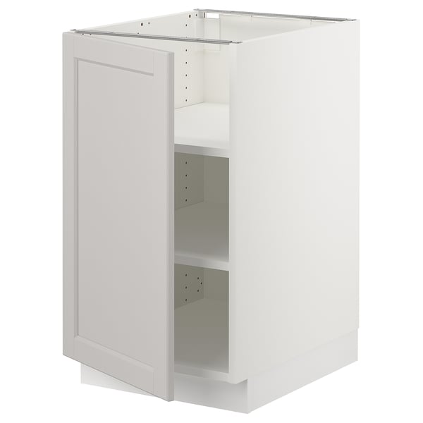 A white SEKTION kitchen cabinet with one adjustable shelf and a door thats not mounted, revealing an empty interior.