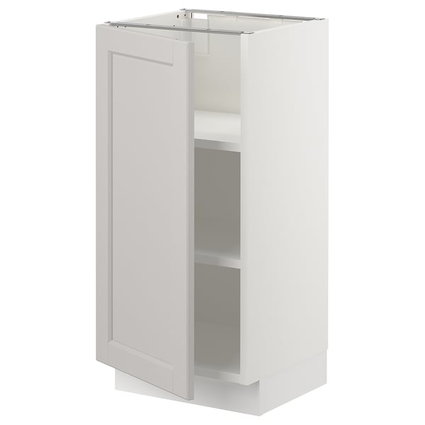 SEKTION, white kitchen cabinet with one door open, light grey lerhyttan fronts, adjustable shelves, classic design.