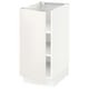 A white SEKTION kitchen cabinet with a single open door, featuring clean lines and adjustable shelves.