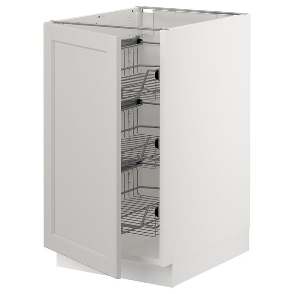 White ikea SEKTION kitchen cabinet with pull-out wire baskets for storing items.