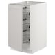 White ikea SEKTION kitchen cabinet with pull-out wire baskets for storing items.
