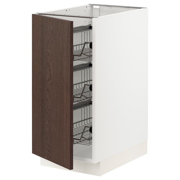 Ikea SEKTION white kitchen cabinet with dark brown wood door, wire baskets.