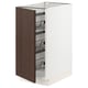 Ikea SEKTION white kitchen cabinet with dark brown wood door, wire baskets.