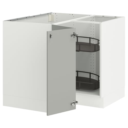 A white SEKTION kitchen cabinet with adjustable shelves and a pull-out organiser.