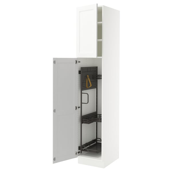 A white SEKTION kitchen cabinet with adjustable shelves and a built-in cleaning accessory.
