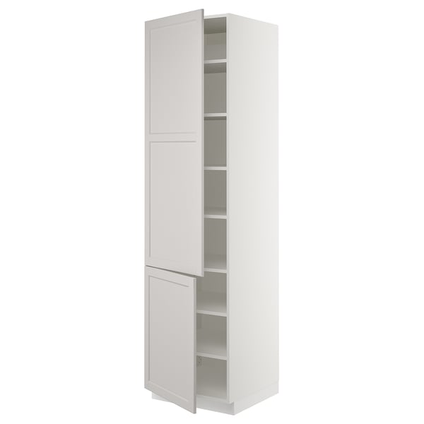 White kitchen cabinet, tall and narrow with a traditional design, two doors, adjustable shelves.