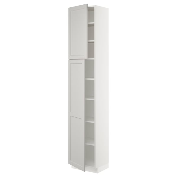 White lerhyttan cabinet, SEKTION kitchen system with adjustable shelves and bevelled edges.