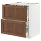 An ikea SEKTION kitchen cabinet with walnut fronts. It has two drawers, a sturdy frame, and is designed for organizing kitchen tools or food items.