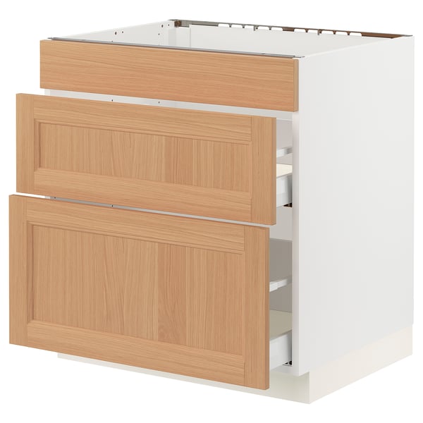 SEKTION kitchen cabinet in light oak wood, three drawers, with white frame, modern design.