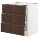 A white SEKTION kitchen cabinet with three dark brown sinarp wooden drawers, each with a metal handle and soft-close mechanism.