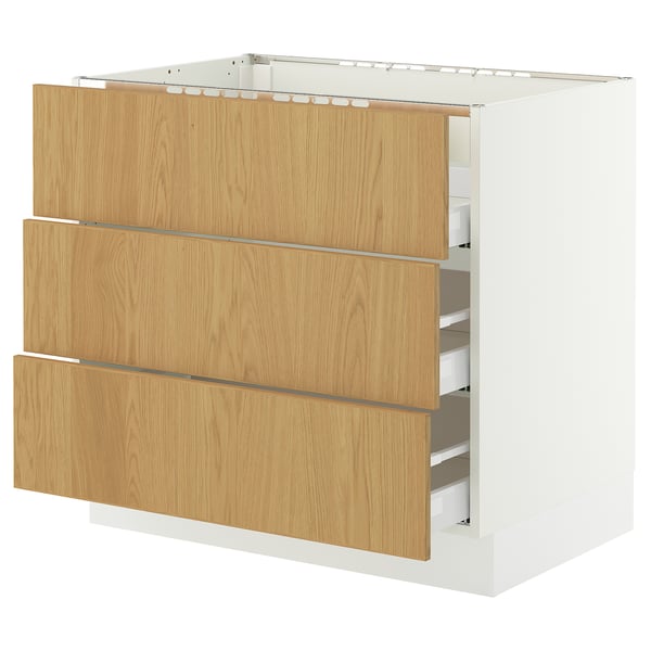 SEKTION oak-veneer kitchen cabinet with white base, three drawers.