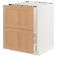 SEKTION kitchen cabinet with oak drawers in white frame.