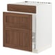 SEKTION kitchen cabinet with walnut-brown wood grain panels on white base.